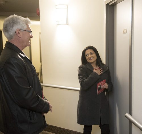 DAVID LIPNOWSKI / WINNIPEG FREE PRESS   Manitoba Liberal Party leader Rana Bokhari and Federal Minister Jim Carr door knocking on the first day of advance voting Saturday April 9, 2016 in an apartment building on Wellington Crescent.