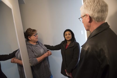 DAVID LIPNOWSKI / WINNIPEG FREE PRESS   Manitoba Liberal Party leader Rana Bokhari and Federal Minister Jim Carr greet former RCMP officer Marge Hudson while door knocking on the first day of advance voting Saturday April 9, 2016 in an apartment building on Wellington Crescent.