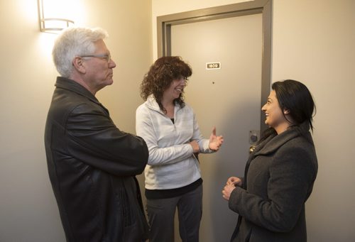 DAVID LIPNOWSKI / WINNIPEG FREE PRESS   Manitoba Liberal Party leader Rana Bokhari and Federal Minister Jim Carr greet Kathy Kennedy while door knocking on the first day of advance voting Saturday April 9, 2016 in an apartment building on Wellington Crescent.