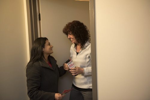 DAVID LIPNOWSKI / WINNIPEG FREE PRESS   Manitoba Liberal Party leader Rana Bokhari and Federal Minister Jim Carr greet Kathy Kennedy while door knocking on the first day of advance voting Saturday April 9, 2016 in an apartment building on Wellington Crescent.
