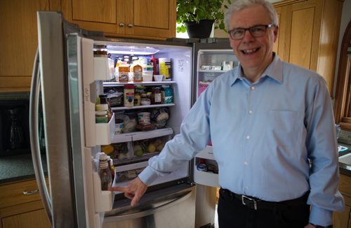 MIKE DEAL / WINNIPEG FREE PRESS NDP leader Greg Selinger shows the Free Press what he has in his refrigerator after inviting the media into his house to make available his 2014 tax return.  160410 - Sunday, April 10, 2016