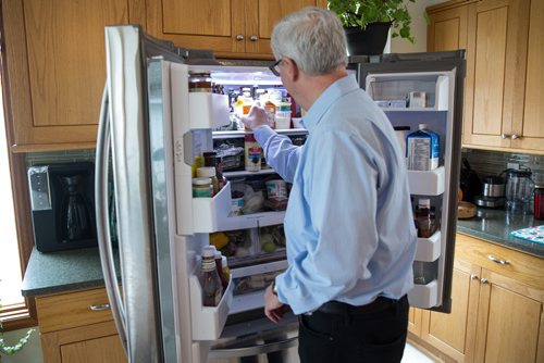 MIKE DEAL / WINNIPEG FREE PRESS NDP leader Greg Selinger shows the Free Press what he has in his refrigerator after inviting the media into his house to make available his 2014 tax return.  160410 - Sunday, April 10, 2016