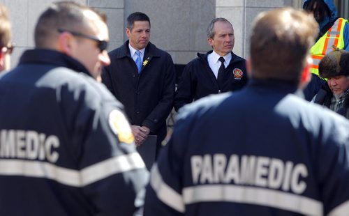 BORIS MINKEVICH / WINNIPEG FREE PRESS Smudging Ceremony led by the Bear Clan Patrol to celebrate 2016 National Public Safety Telecommunicators Week.(middle L-R) His Worship, Mayor Brian Bowman and Chief John Lane, Winnipeg Fire Paramedic Service was there. Event held at City Hall courtyard  510 Main Street. April 11, 2016 -30-
