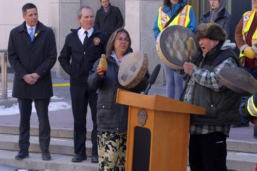 BORIS MINKEVICH / WINNIPEG FREE PRESS Smudging Ceremony led by the Bear Clan Patrol to celebrate 2016 National Public Safety Telecommunicators Week. (left) His Worship, Mayor Brian Bowman and (2nd from left) Chief John Lane, Winnipeg Fire Paramedic Service was there. Event held at City Hall courtyard  510 Main Street. April 11, 2016 -30-