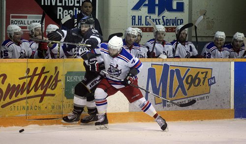 PHIL HOSSACK / WINNIPEG FREE PRESS Shelbrook Elks #13 Russ Neilson gets rubbed out against the Stoney Creek Generals bench by # 7Kyle Frieday Thursday evening in Steinbach's Allan Cup Action. See Jeff Hamilton story. . PHIL HOSSACK / WINNIPEG FREE PRESS
