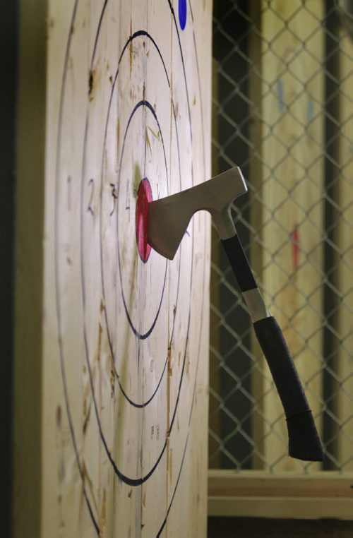 RUTH BONNEVILLE / WINNIPEG FREE PRESS  Intersection piece on Bad Axe, a biz that invites folks to come on down and fire axes at wooden targets. (these are small hatchet type axes you throw with both hands over your head - sort of the way you inbound a ball in soccer.  April 16, 2016