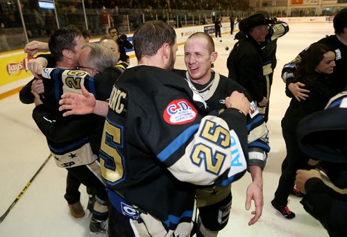 TREVOR HAGAN / WINNIPEG FREE PRESS Bentley Generals Curtis Austring (25) and Don Morrison (4) celebrate winning the 2016 Allan Cup in Steinbach after defeating the Southeast Prairie Thunder in overtime, Saturday, April 16, 2016.