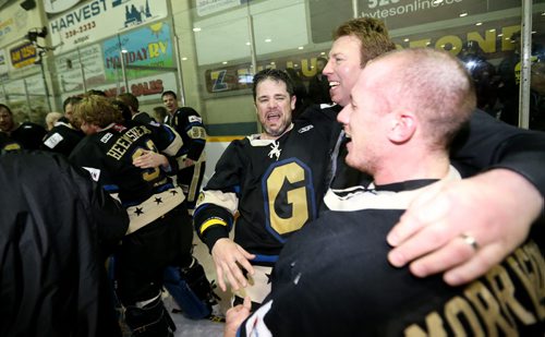 TREVOR HAGAN / WINNIPEG FREE PRESS Bentley Generals Sean Robertson (29), head coach Ryan Tobler and Don Morrison (4) celebrate winning the 2016 Allan Cup in Steinbach after defeating the Southeast Prairie Thunder in overtime, Saturday, April 16, 2016.