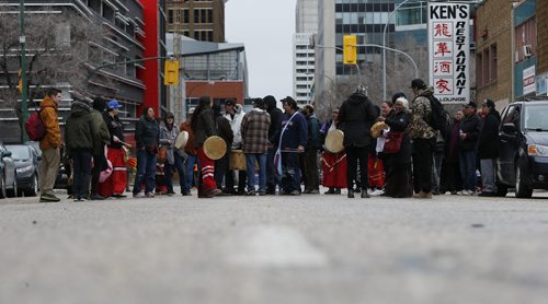JOHN WOODS / WINNIPEG FREE PRESS People protest in front of the Indigenous and Northern Affairs Canada (INAC) offices by blocking Hargrave and occuping the offices of INAC in Winnipeg Sunday, April 17, 2016.