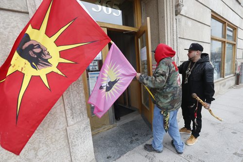 JOHN WOODS / WINNIPEG FREE PRESS People protest in front of the Indigenous and Northern Affairs Canada (INAC) offices by blocking Hargrave and occuping the offices of INAC in Winnipeg Sunday, April 17, 2016.