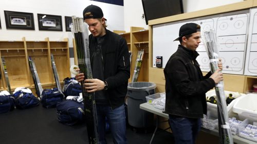 WAYNE GLOWACKI / WINNIPEG FREE PRESS    Manitoba Moose players Scott Kosmachuk at right and Axel Blomqvist in their dressing room at the MTS Icleplex. With the season now over, players were cleaning out their lockers and meeting with coaches Monday. Tim Campbell story.  April 18  2016