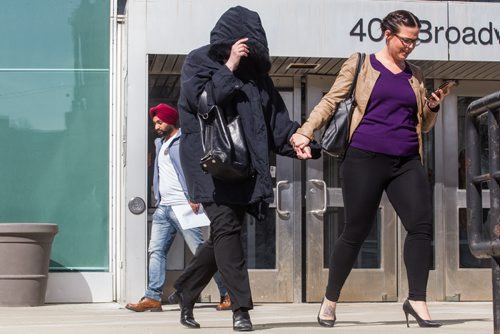 MIKE DEAL / WINNIPEG FREE PRESS Andrea Giesbrecht, 42, leaves court Monday afternoon after she appeared on six charges of concealing a child's body.  160418 - Monday, April 18, 2016