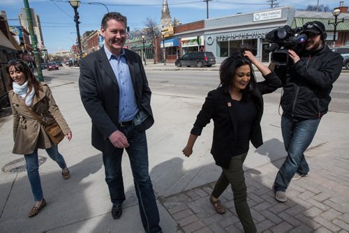 MIKE DEAL / WINNIPEG FREE PRESS Manitoba Liberal leader Rana Bokhari walks along Osborne Street Monday afternoon on her way to talk to the media at the intersection of River Ave and Osborne St. 160418 - Monday, April 18, 2016