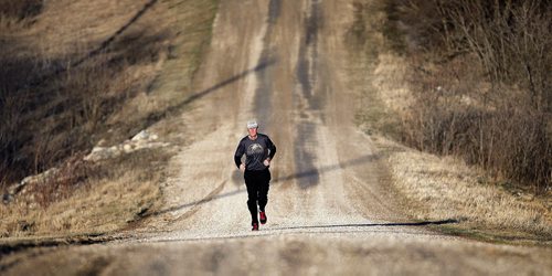PHIL HOSSACK / WINNIPEG FREE PRESS Brian Pallister runs the gravel road at his family's farmstead near Edwin Mb SW of Portage La Prairie Monday evening. It's been a personal tradition for him to visit the farm run the section to prepare for election day. April 18, 2016 - APRIL 15, 2016