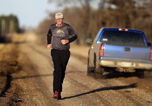 PHIL HOSSACK / WINNIPEG FREE PRESS One the eve of Manitoba's Provincial election Brian Pallister runs the gravel road at his family's farmstead near Edwin Mb SW of Portage La Prairie Monday evening. It's been a personal tradition for him to visit the farm run the section to prepare for election day. April 18, 2016 - APRIL 15, 2016