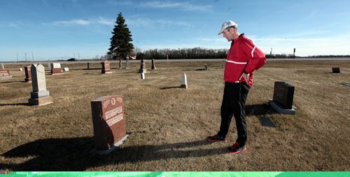 PHIL HOSSACK / WINNIPEG FREE PRESS One the eve of Manitoba's Provincial election Brian Pallister stops en route to the family farmstead near Edwin Mb, SW of Portage la Prairie to visit his grandparents grave alongside the trans Canada Highway. . It's been a personal tradition for him to visit the farm run the section to prepare for election day. April 18, 2016 - APRIL 15, 2016