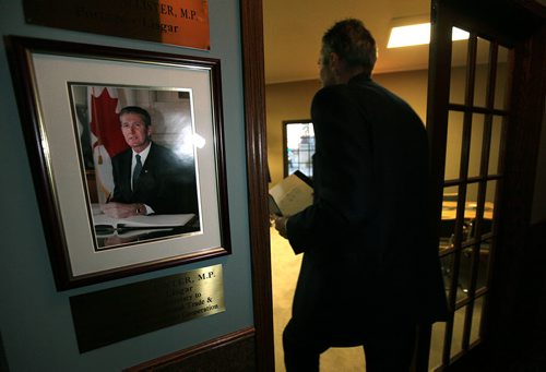 PHIL HOSSACK / WINNIPEG FREE PRESS One the eve of Manitoba's Provincial election after running the section roads around his family homestead near Edwin Mb. Brian Pallister passes a portrait from his time in Ottawa as a Federal MP as gathers his notes to prepare a speech to deliver after the results arrive Election night.   April 18, 2016 - APRIL 15, 2016