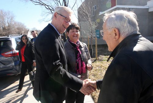 JOE BRYKSA / WINNIPEG FREE PRESS NDP leader Greg Selinger with his wife Claudette Toupin chat with former mla/city councilor Paul Marion outside Tuesday Ecole Tache School in Winnipeg after he voted , Apr 19 , 2016.(Standup Photo)