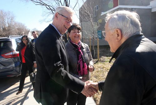 JOE BRYKSA / WINNIPEG FREE PRESS  NDP leader Greg Selinger with his wife Claudette Toupin chat with former mla/city councilor Paul Marion outside Tuesday Ecole Tache School in  Winnipeg after he voted , Apr 19 , 2016.(Standup Photo)