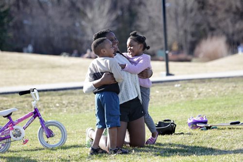 RUTH BONNEVILLE / WINNIPEG FREE PRESS

FOUR-YEAR-OLD TWINS Josephine AND Joseph Tshibamba GIVE THER OLDER SISTER Ceclia A BIG HUG WHILE PLAYING  AT ASSINIBOINE PARK IN THE LATE AFTERNOON TUESDAY.  APRIL 19, 2016