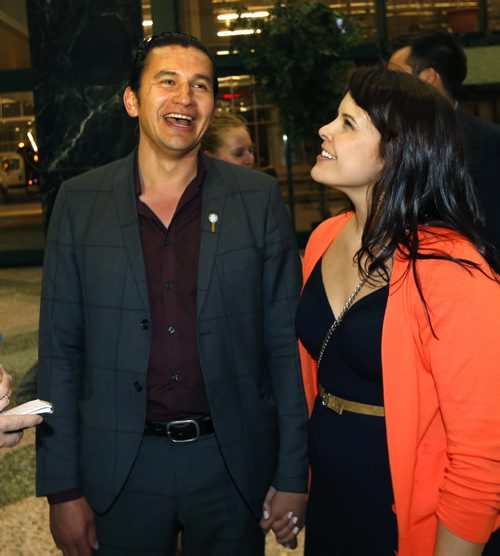 WAYNE GLOWACKI / WINNIPEG FREE PRESS    NDP Fort Rouge candidate Wab Kinew arrives with his wife Lisa Monkman at the NDP 2016 post election gathering held Tuesday at the RBC Convention Centre Winnipeg. Kristin Annable  story  April 19  2016