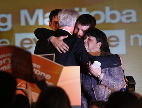 WAYNE GLOWACKI / WINNIPEG FREE PRESS    NDP Leader Greg Selinger with his wife Claudette and sons Eric and Pascal,left, on stage the NDP 2016 post election gathering Tuesday at the RBC Convention Centre Winnipeg. Kristin Annable  story  April 19  2016