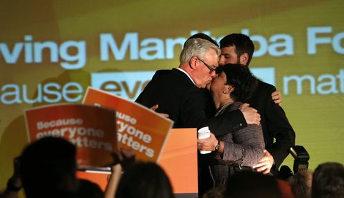 WAYNE GLOWACKI / WINNIPEG FREE PRESS    NDP Leader Greg Selinger with his wife Claudette and sons Eric and Pascal on stage at the NDP 2016 post election gathering Tuesday at the RBC Convention Centre Winnipeg. Kristin Annable  story  April 19  2016