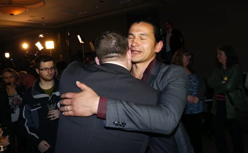 WAYNE GLOWACKI / WINNIPEG FREE PRESS    NDP Fort Rouge candidate Wab Kinew embraces a supporter at the NDP 2016 post election gathering held Tuesday at the RBC Convention Centre Winnipeg. Kristin Annable  story  April 19  2016