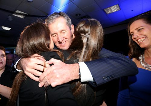TREVOR HAGAN / WINNIPEG FREE PRESS Progressive Conservative leader, and Premier designate Brian Pallister, his wife Esther and their daughters, Quinn and Shawn arrive to the party at CanadInns Polo Park, Tuesday, April 19, 2016.