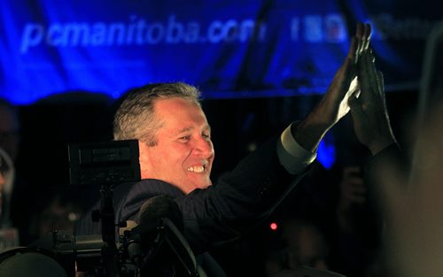 PHIL HOSSACK / WINNIPEG FREE PRESS Brian Pallister high fives his way to the stage at PC headquarters Tuesday as the Premier Elect. See story. April 19, 2016