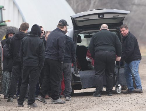 JOE BRYKSA / WINNIPEG FREE PRESS  Woodland Hutterite Colony, Family member mourn after the body of 11 yr old Jodi Hofer is into a funeral van . Hofer  went missing yesterday around 5 pm in a spillwaynear the colony- Family members recovered herbody in the watershed this morning around 730 Am- Apr 20 , 2016. Woodland Colony is near Poplar Point , MB(See Bill Redekop story)