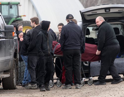 JOE BRYKSA / WINNIPEG FREE PRESS  Woodland Hutterite Colony, Family member mourn after the body of 11 yr old Jodi Hofer is into a funeral van . Hofer  went missing yesterday around 5 pm in a spillwaynear the colony- Family members recovered herbody in the watershed this morning around 730 Am- Apr 20 , 2016. Woodland Colony is near Poplar Point , MB(See Bill Redekop story)