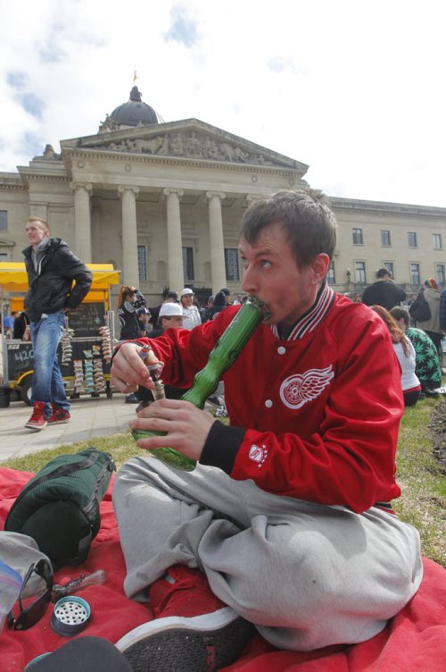 BORIS MINKEVICH / WINNIPEG FREE PRESS 420 event at the Manitoba Legislature. Eric Sorrie takes a hit from the bong. April 20, 2016