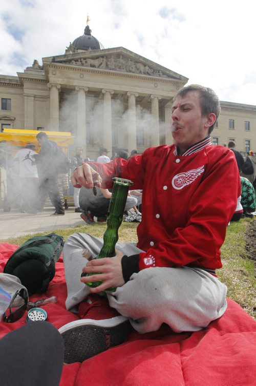 BORIS MINKEVICH / WINNIPEG FREE PRESS 420 event at the Manitoba Legislature. Eric Sorrie takes a hit from the bong. April 20, 2016