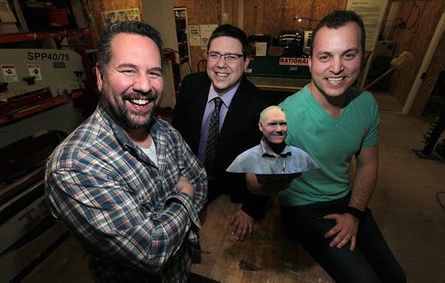 PHIL HOSSACK / WINNIPEG FREE PRESS Left to right - Jeff Ryzner, Michael Legary and Chris Johnson pose in the mock up lab at "AssentWorks" Wednesday afternoon. They're holding a 3-D print of another Assent co-founder Kerry Stevenson. See Martin Cash story re:merger of Eureka Project, the business incubator at the U of M.  April 20, 2016