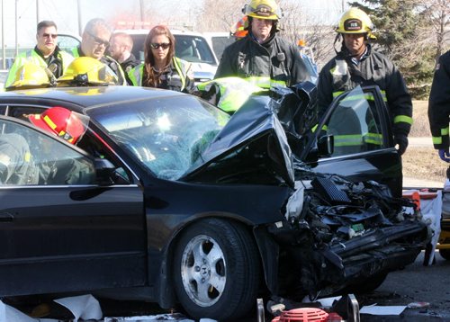 ¬JOE BRYKSA / WINNIPEG FREE PRESS  Winnipeg Fire Department assisted Winnipeg EMS with extrication this morning at a mva between a car and a large transport truck on Brookside Blvd and Omands Creek Blvd.- Unknown injuries, Apr 21 , 2016.(Breaking News)