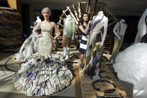 BORIS MINKEVICH / WINNIPEG FREE PRESS (L-R) Fashion model Claire Havlicek wears "Paper Princess", a design delevoped by fashion artist Michelle Sin. The photo was taken at centre court at Polo Park Shopping Centre today. Trashion Pieces exhibit. Timed out to mesh with Earth Day tomorrow. April 21, 2016