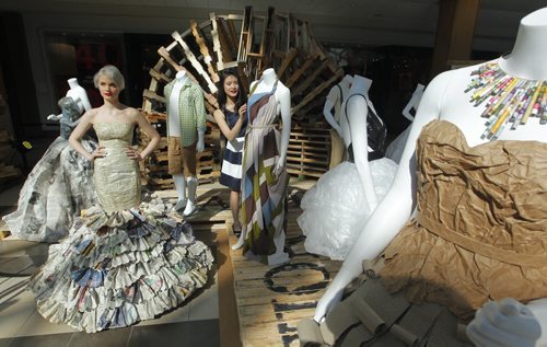 BORIS MINKEVICH / WINNIPEG FREE PRESS (L-R) Fashion model Claire Havlicek wears "Paper Princess", a design delevoped by fashion artist Michelle Sin. The photo was taken at centre court at Polo Park Shopping Centre today. Trashion Pieces exhibit. Timed out to mesh with Earth Day tomorrow. April 21, 2016