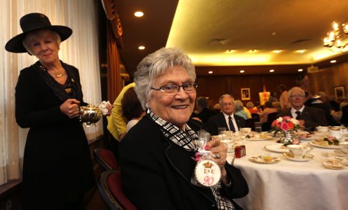 WAYNE GLOWACKI / WINNIPEG FREE PRESS   At right, Corrine Genereux,90, attended a tea in Government House Thursday hosted by Janice Filmon, Lieutenant-Governor of Manitoba in honour of Queen Elizabeth IIs 90th birthday. At left, Lee Anderson helps out serving tea at the event for Manitobans born in 1926.   Britain's oldest and longest-serving monarch is celebrating the big day at Buckingham Palace.     Erin DeBooy story April 21  2016