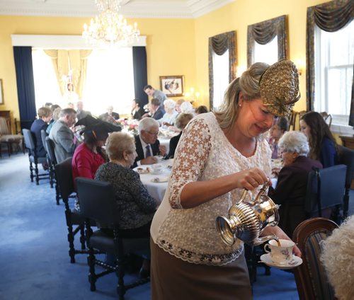 WAYNE GLOWACKI / WINNIPEG FREE PRESS   Kimberley Massaroni helps out serving tea in Government House Thursday  at an event in honour of Queen Elizabeth IIs 90th birthday. The two teas hosted by Janice Filmon, Lieutenant-Governor of Manitoba was for   Manitobans born in 1926 , the event  included singing Happy Birthday to the Queen.   Britain's oldest and longest-serving monarch is celebrating the big day at Buckingham Palace.     Erin DeBooy story April 21  2016