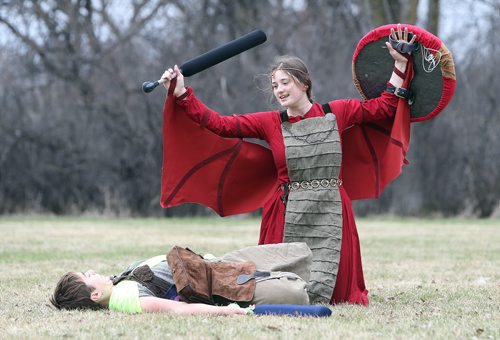 JASON HALSTEAD / WINNIPEG FREE PRESS  Members of the Wildgard fantasy foam combat group, Ethan Gamble, costumed as Iguana Lizardwizard (left) and Catherine Friesen, dressed as Dragon of Fire and Earth, do battle at Assiniboine Park as part of the Endreign event on April 23, 2016.