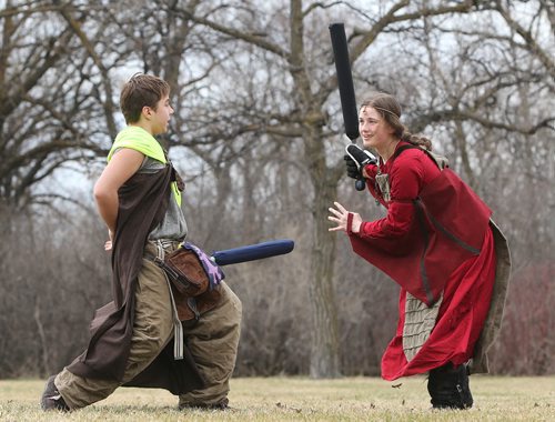 JASON HALSTEAD / WINNIPEG FREE PRESS  Members of the Wildgard fantasy foam combat group, Ethan Gamble, costumed as Iguana Lizardwizard (left) and Catherine Friesen, dressed as Dragon of Fire and Earth, do battle at Assiniboine Park as part of the Endreign event on April 23, 2016.