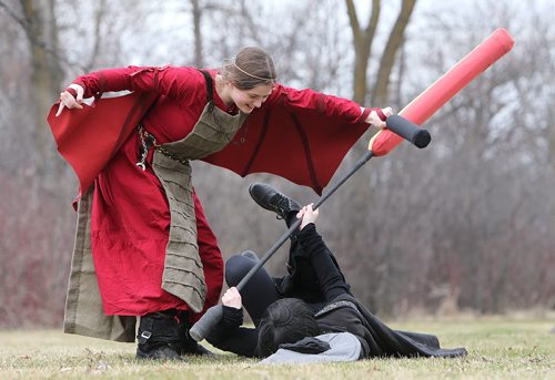 JASON HALSTEAD / WINNIPEG FREE PRESS  Members of the Wildgard fantasy foam combat group, Catherine Friesen (left), dressed as Dragon of Fire and Earth, and Cassidy Allison, costumed as the witch Nil, do battle at Assiniboine Park as part of the Endreign event on April 23, 2016.