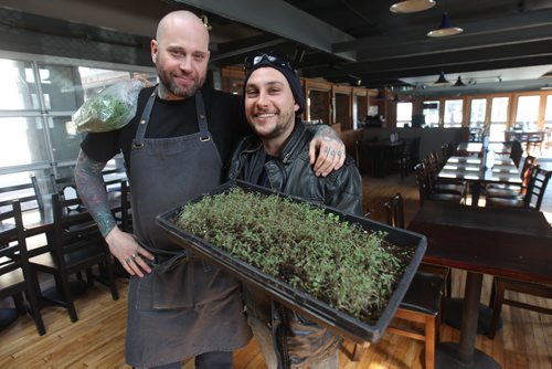JOE BRYKSA / WINNIPEG FREE PRESS  Constantine Gamvrelis delivers sprouts to head chef Mike Day at the Black Rabbit in the Village  .(See 49.8 story)