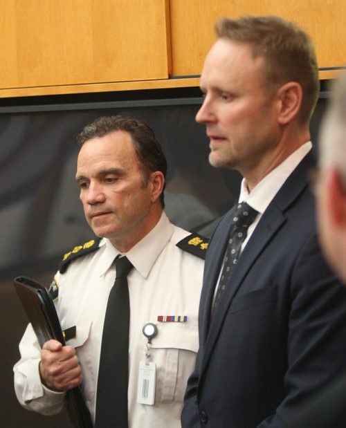 WAYNE GLOWACKI / WINNIPEG FREE PRESS  At left, Winnipeg Police Deputy Chief Danny Smyth and Sgt. Wes Rommel with the Homicide Unit arrive at the news conference in the PSB Tuesday regarding an arrest of a 28 year old male in the murder of Simone Sanderson.¤Erin DeBooy story   April 26 2016