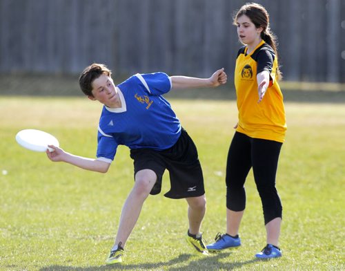 BORIS MINKEVICH / WINNIPEG FREE PRESS J. H. Bruns Broncos Blake Treffner works the disc past Windsor Park Royals Kyla Tomlinson in Highschool mixed Ultimate play at Shamrock Park in Southdale. This is the first game for south Winnipeg teams. Broncos lost 8-13 to the Royals. April 26, 2016