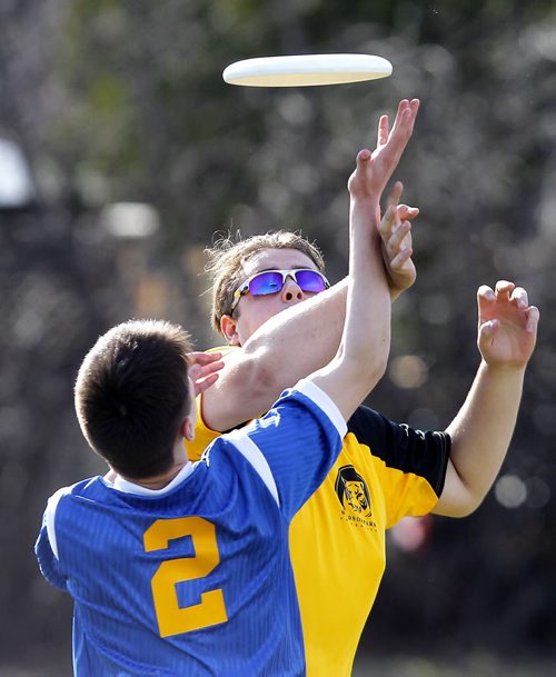 BORIS MINKEVICH / WINNIPEG FREE PRESS J. H. Bruns Bronco #2 Josh Magri battles for the disc with Windsor Park Royals Tim Brabant in Highschool mixed Ultimate play at Shamrock Park in Southdale. This is the first game for south Winnipeg teams. Broncos lost 8-13 to the Royals. April 26, 2016