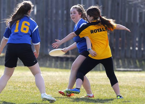 BORIS MINKEVICH / WINNIPEG FREE PRESS J. H. Bruns Bronco Rachel Treffner tries to get thedisc past a Windsor Park Royals in Highschool mixed Ultimate play at Shamrock Park in Southdale. This is the first game for south Winnipeg teams. Broncos lost 8-13 to the Royals. April 26, 2016