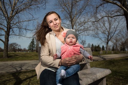 MIKE DEAL / WINNIPEG FREE PRESS Bailey Wall, 24, with her daughter Jordan, 6m, at the Glen Eden Memorial Gardens where a MADD memorial wall is going to be built for the victims of impaired driving. Bailey is the sister to Amy Gilbert who was killed by a drunk driver two years ago. 160427 - Wednesday, April 27, 2016