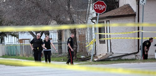 PHIL HOSSACK / WINNIPEG FREE PRESS City Police investigate the scene in the 1800 block of Alexander ave where a man was stabbed Wednesday afternoon. See Alex Paul's story. April 27, 2016